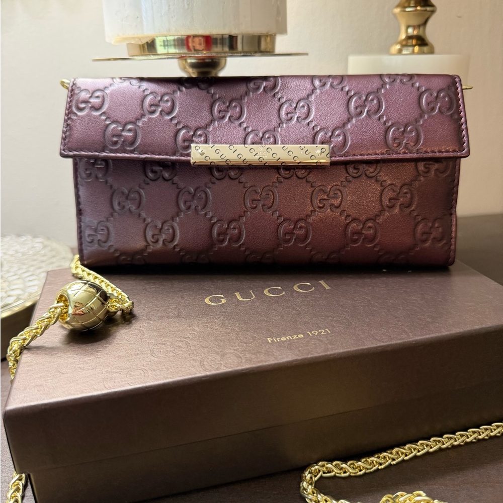Gucci Embossed Purple Leather Clutch
